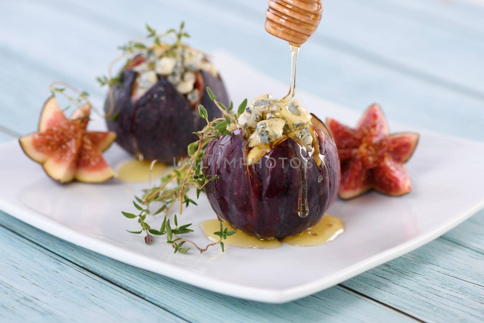 Figs stuffed with blue cheese and thyme, seasoned with honey