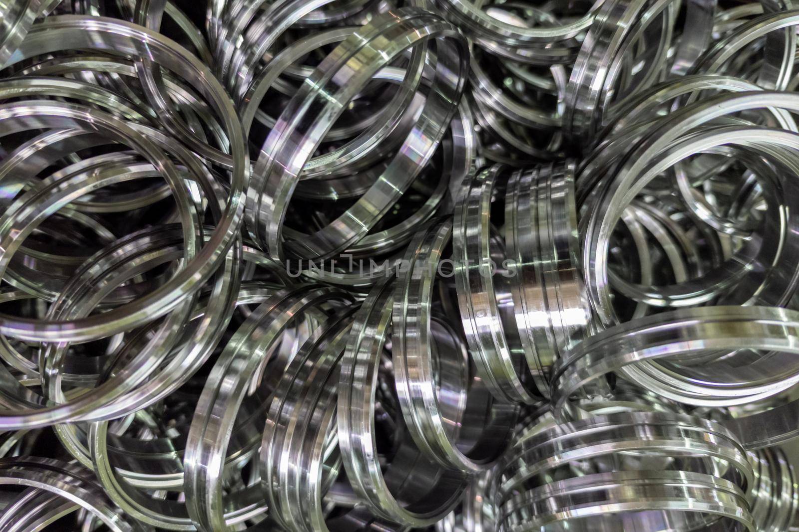pile of shiny steel rings after cnc turning operations.