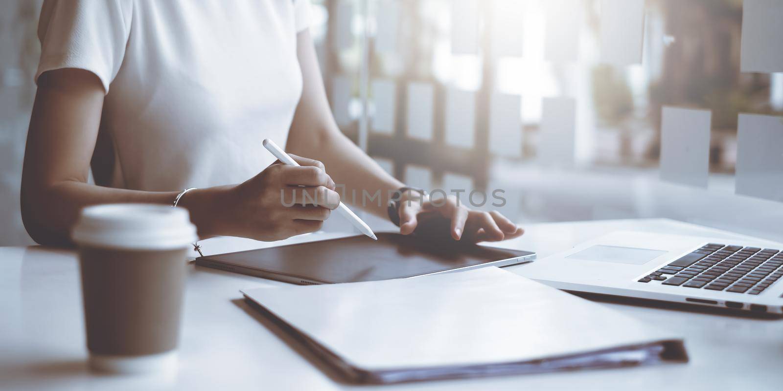 Casual business woman writing on notebook in home office. Business planning, tax, account, financial concept