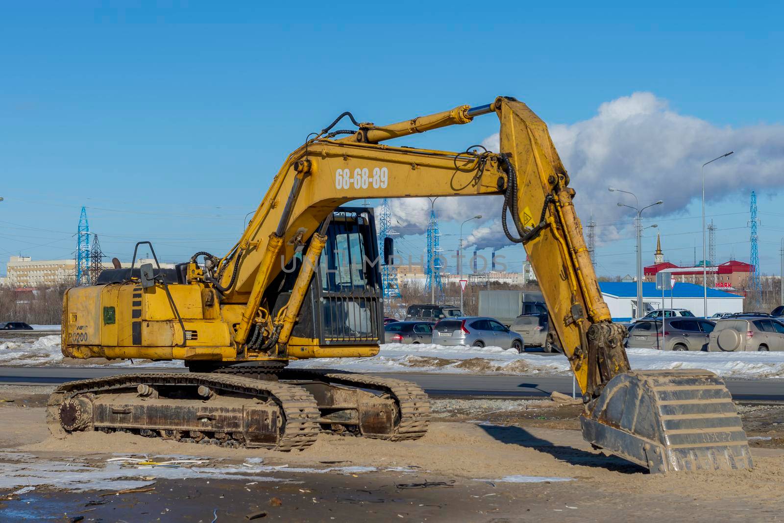 Yellow excavator or Bulldozers in town. Surgut, Russia - 20 April, 2021. by Essffes