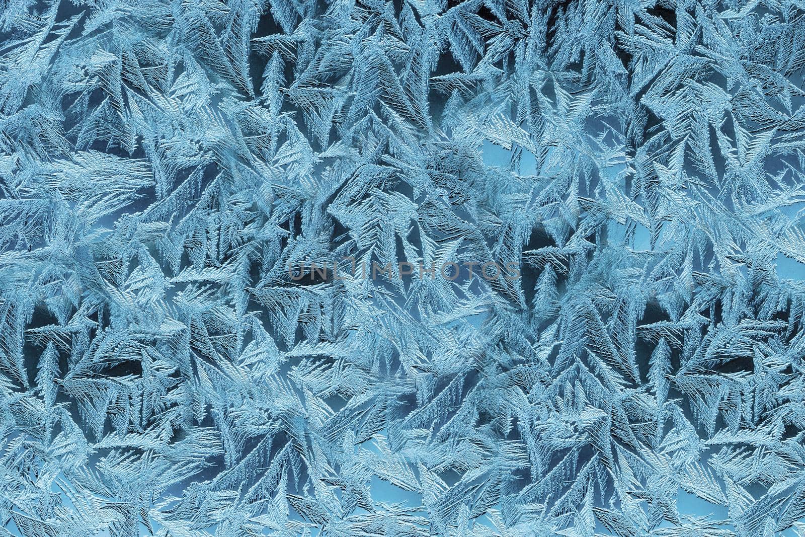 Textured frost patterns on the blue window.Texture or background