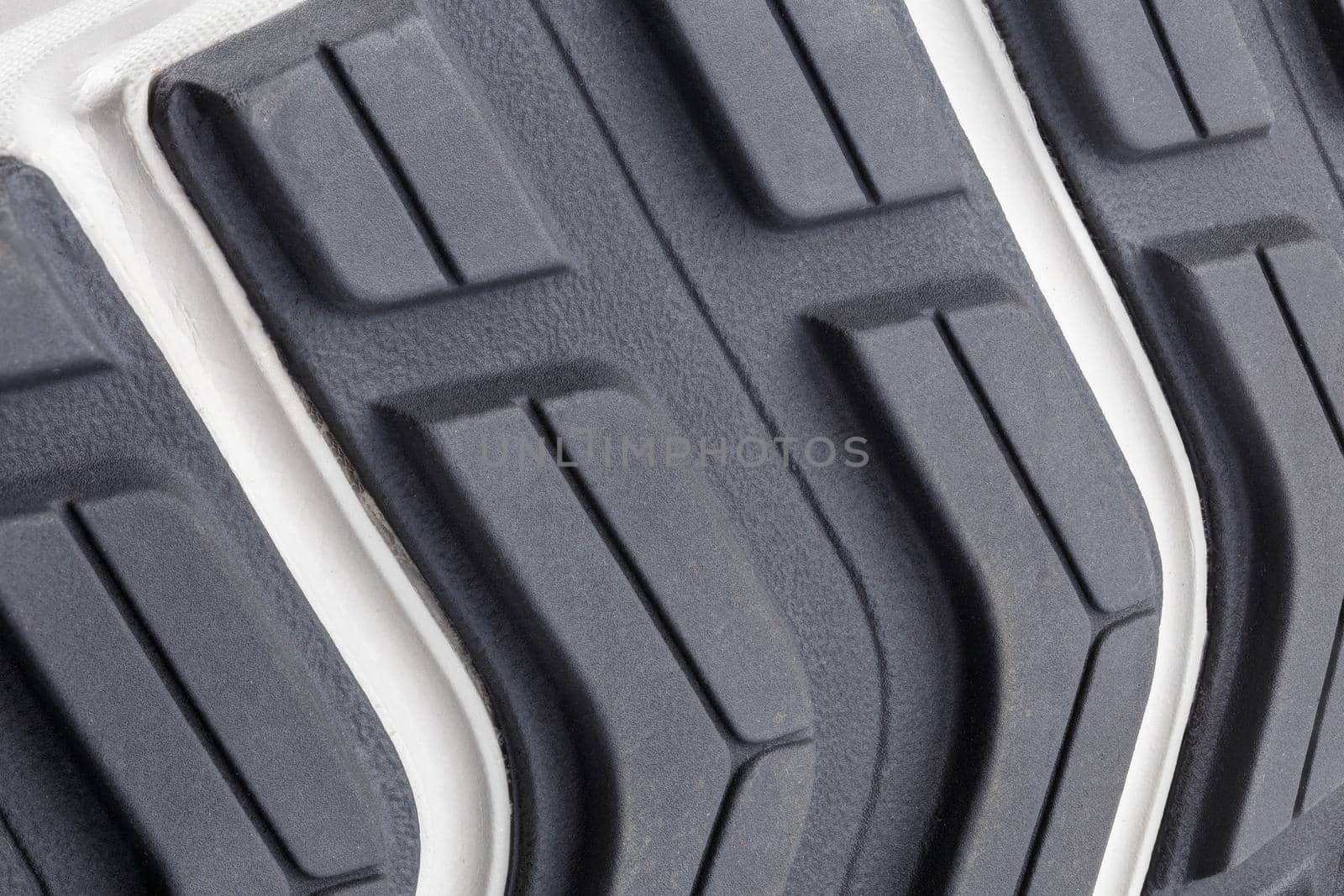 close-up full frame background of new generic contemporary sneakers outsole with protector shapes.