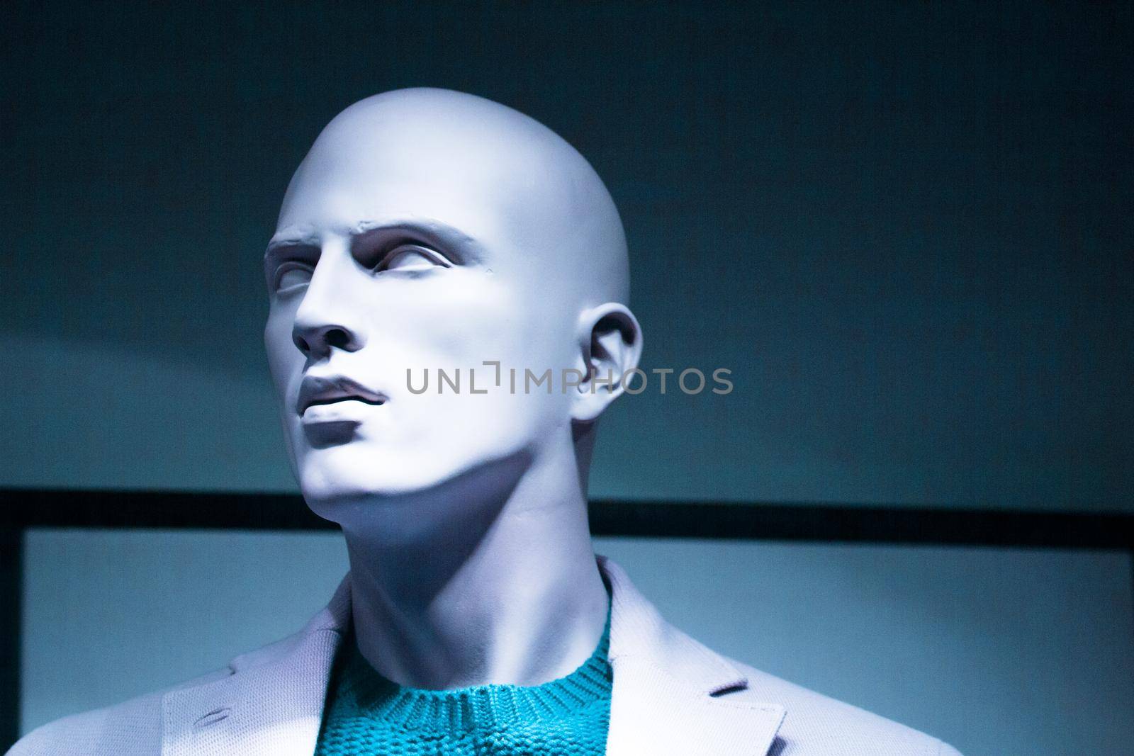 Portrait of a male mannequin with mysterious expression. No people