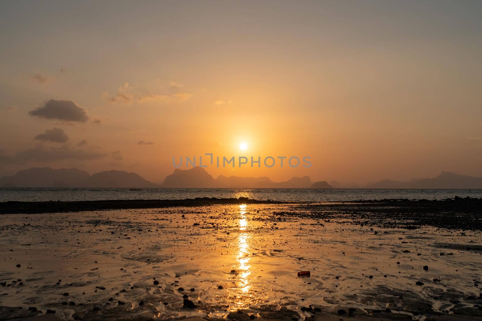 Tropical nature clean beach sunset sky time with sun light. by Suwant