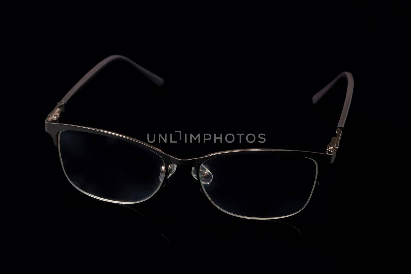 Glasses in fashionable frames on a black background by vizland