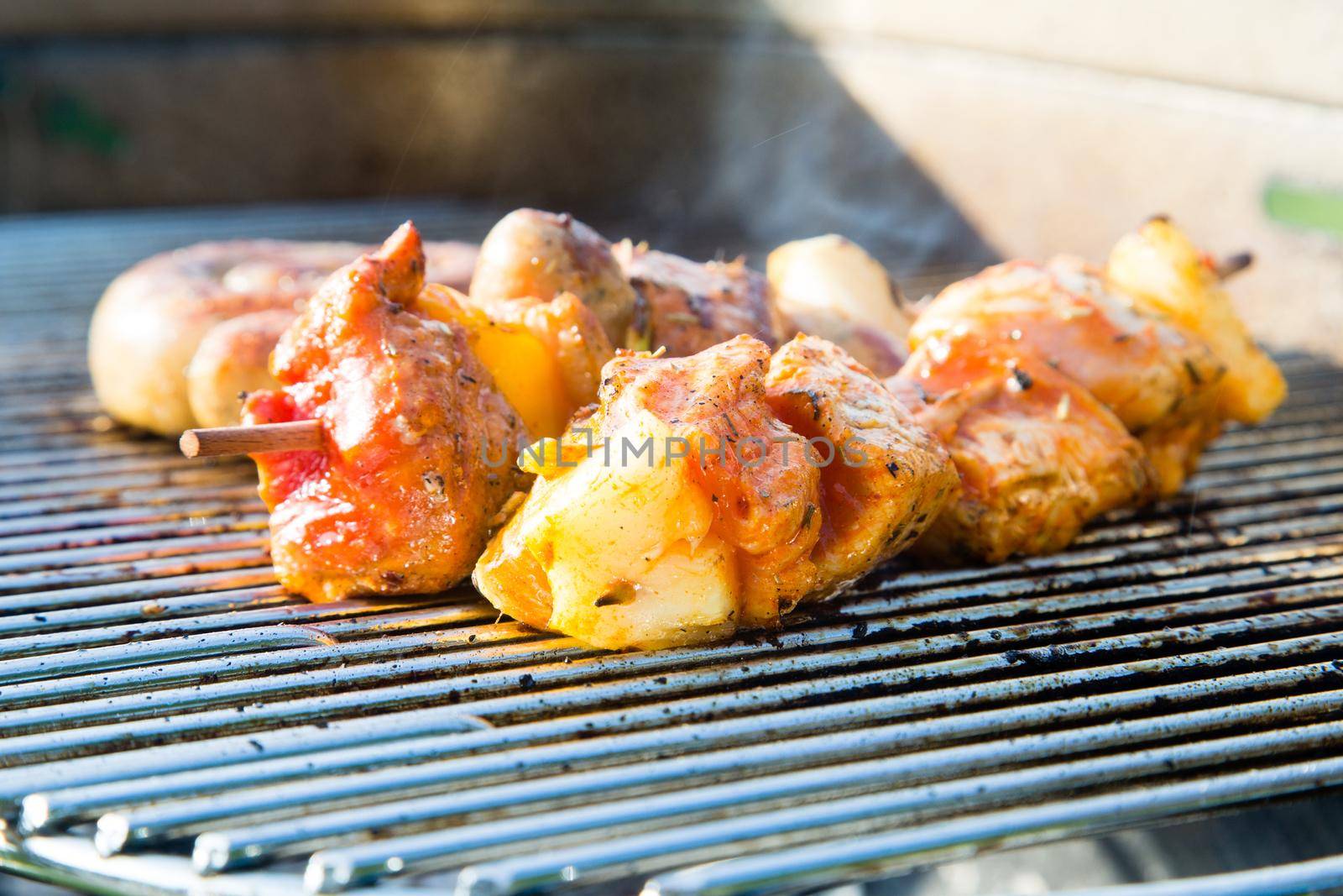 Grilled meat on a summer barbecue in the garden