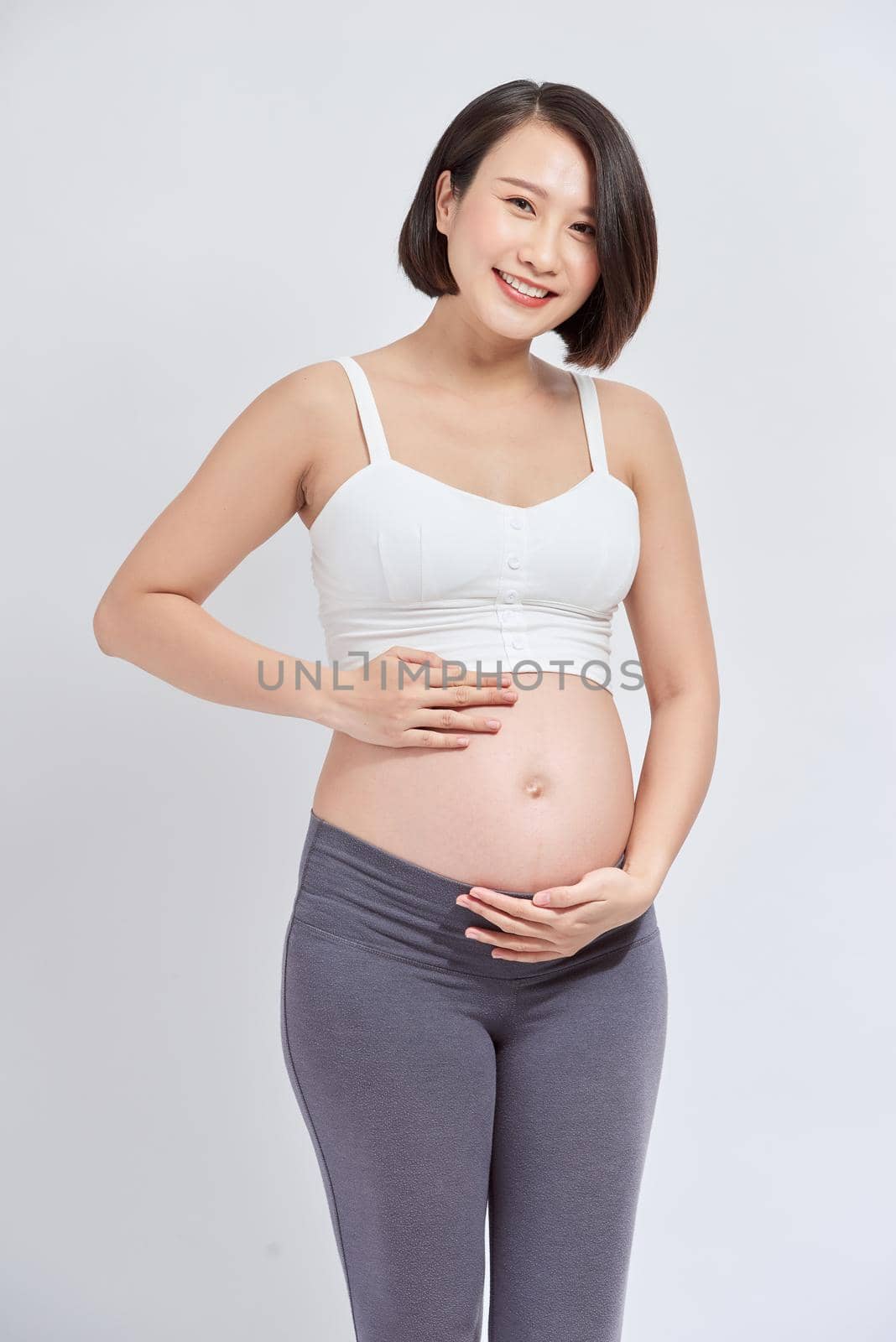 Portrait of the young happy smiling pregnant woman by makidotvn