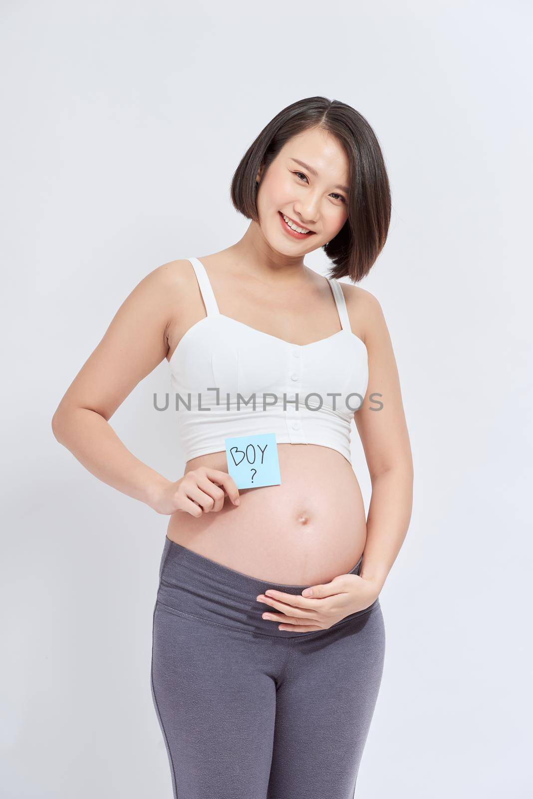Belly of a pregnant woman with stickers by makidotvn