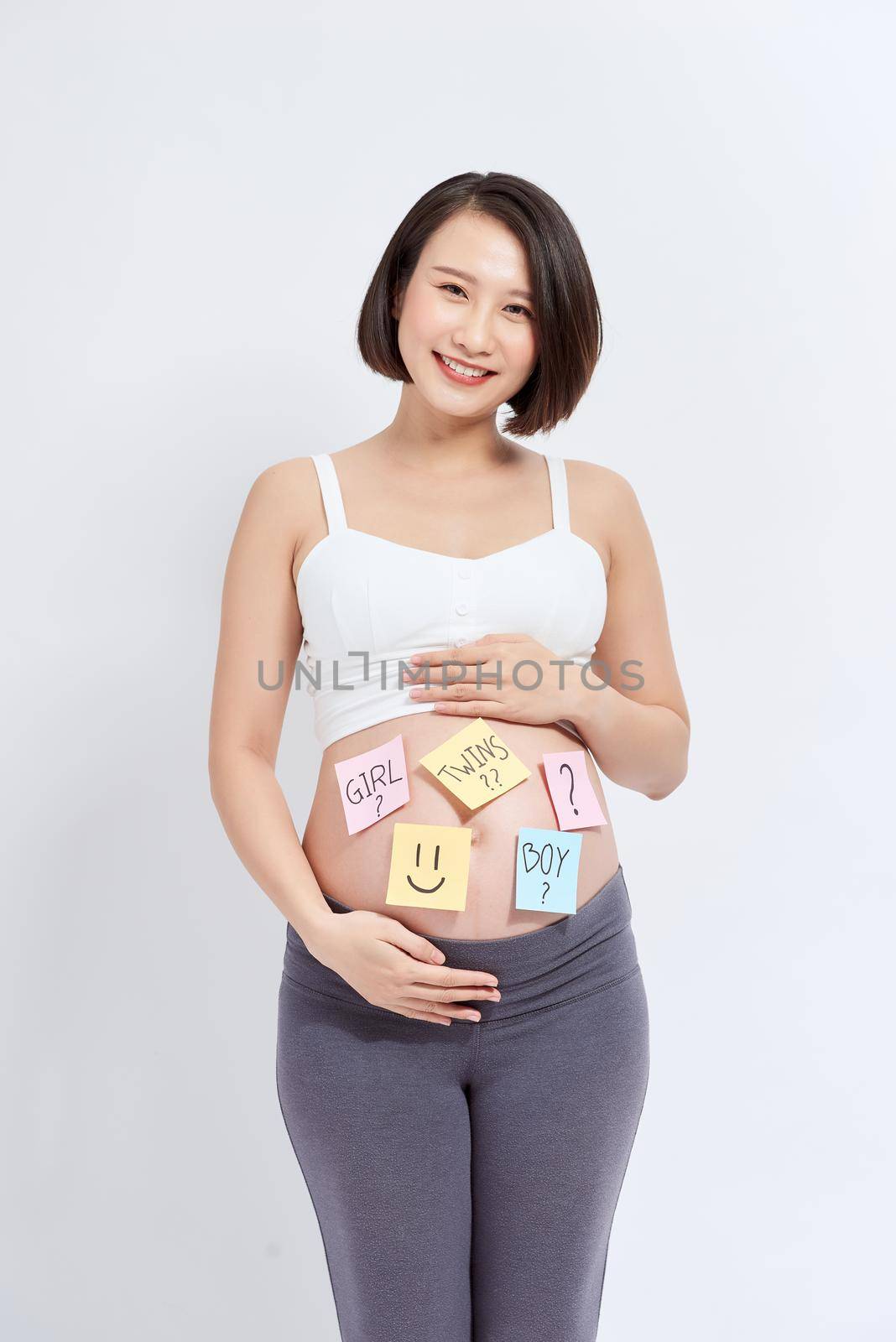 Belly of a pregnant woman with stickers by makidotvn
