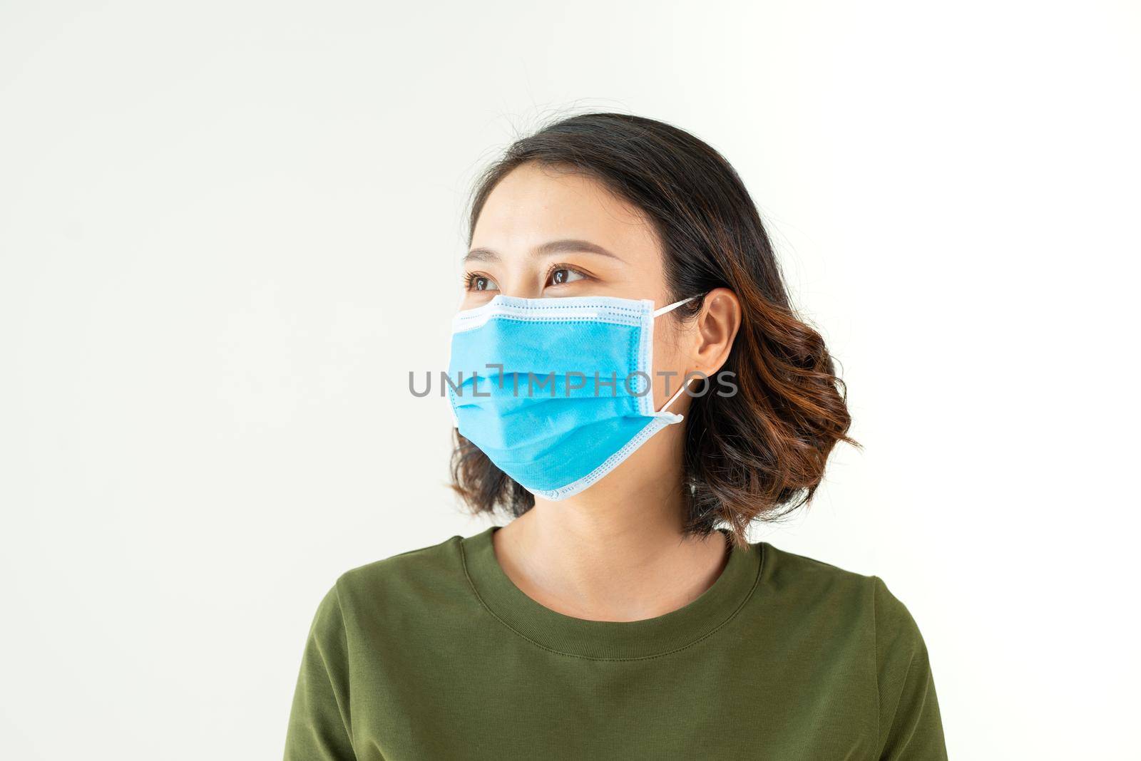 Woman wearing face mask because of Air pollution or virus epidemic in the city by makidotvn
