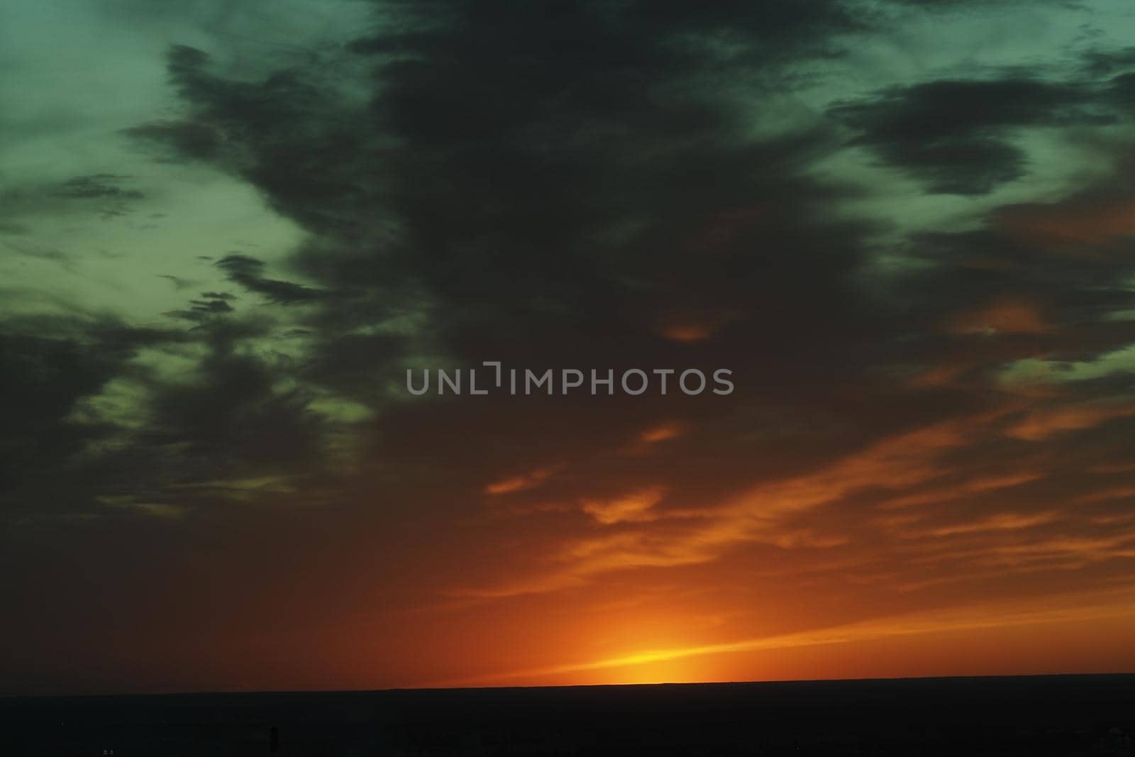It's a beautiful sunset. horizon. The sky in the evening with clouds and the setting sun. High quality photo