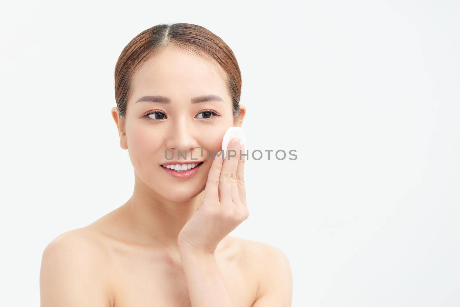 health and beauty concept - beautiful woman with cotton pad