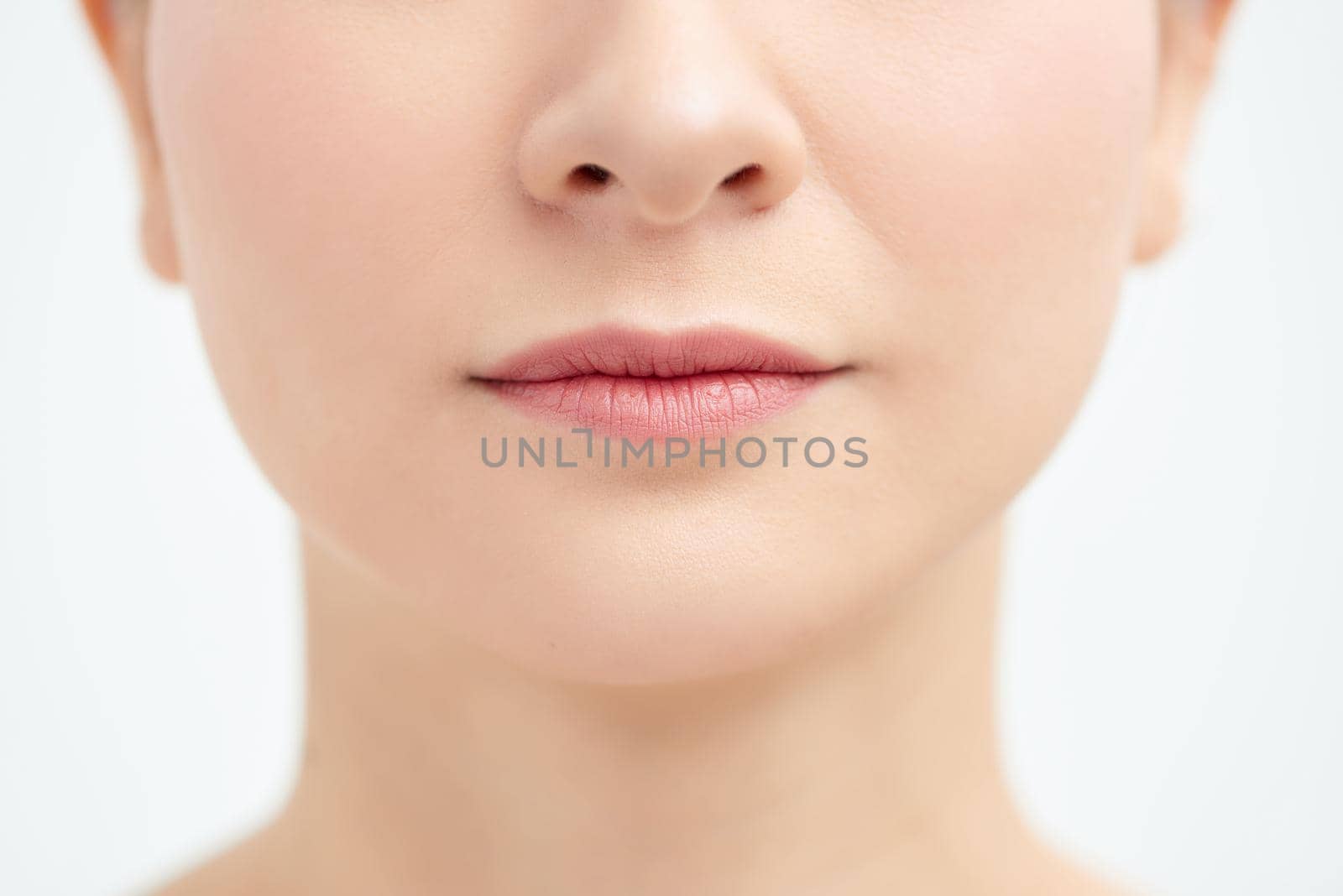 Close up cropped half face portrait of attractive, nude, natural, perfect, ideal girl isolated on white background by makidotvn