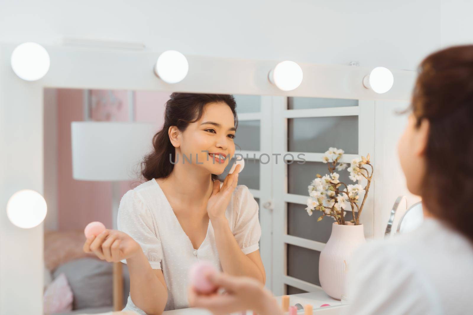 Skincare. Young Woman Removing Makeup Using Cotton Pad Standing In Bathroom. Panorama, Empty Space