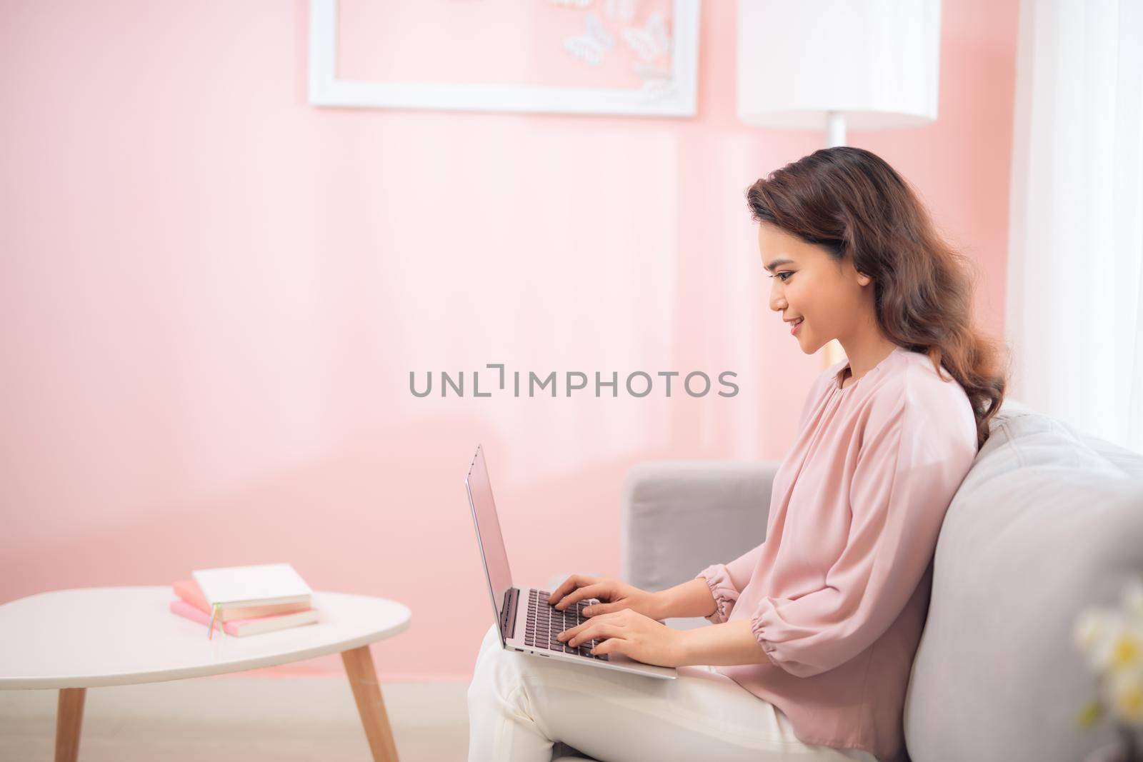 young asian woman lifestyle image using laptop computer