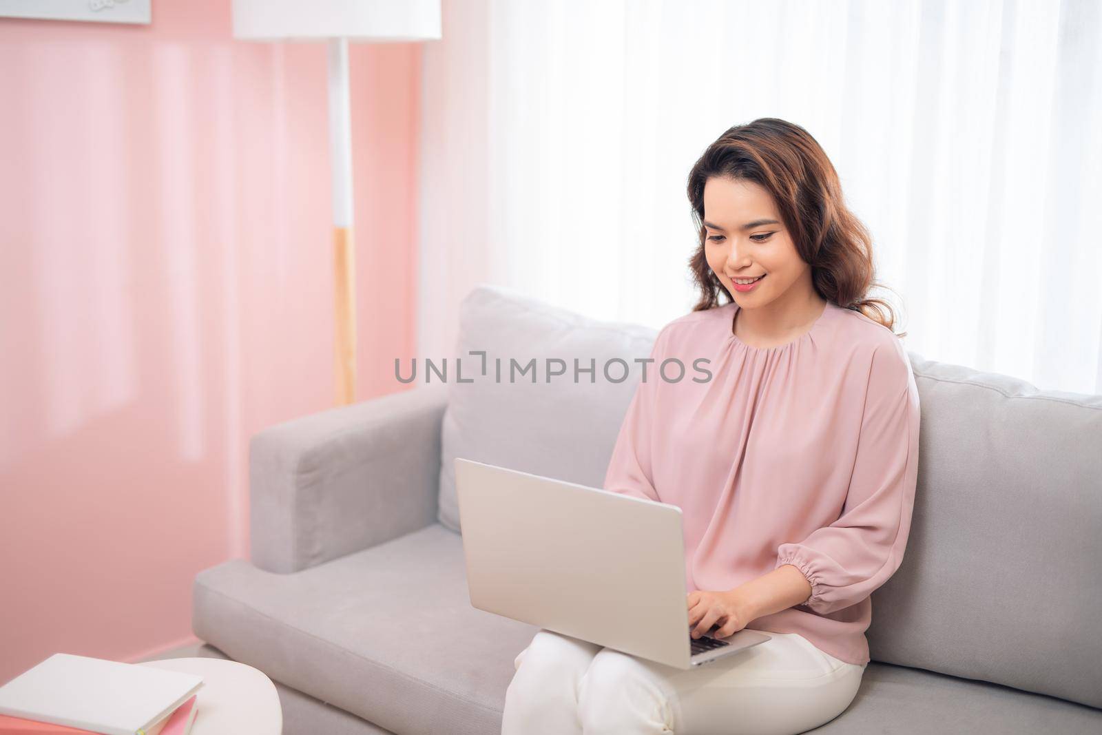 young asian woman lifestyle image using laptop computer