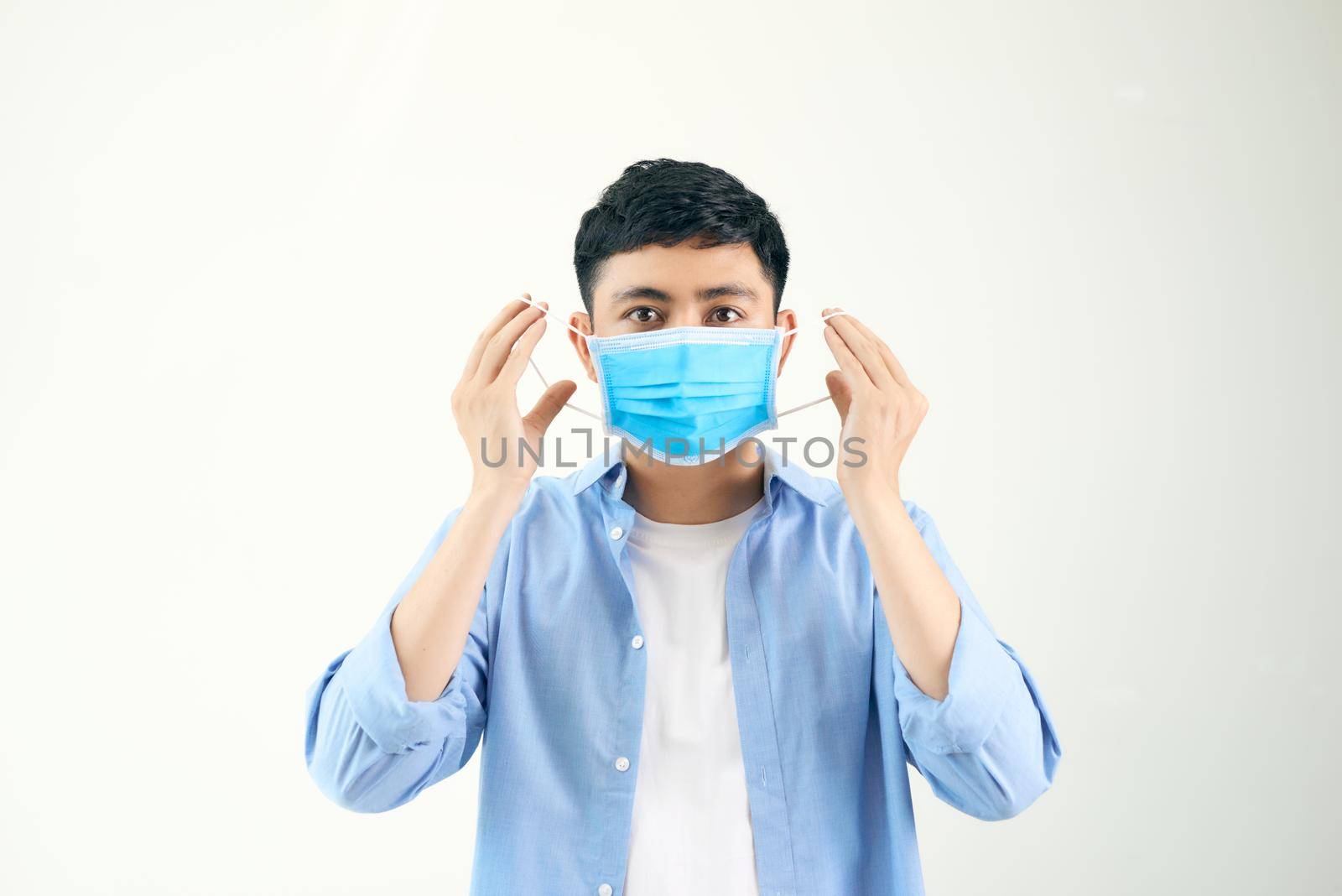 Man wearing an anti virus protection mask to prevent others from corona COVID-19 and SARS cov 2 infection by makidotvn