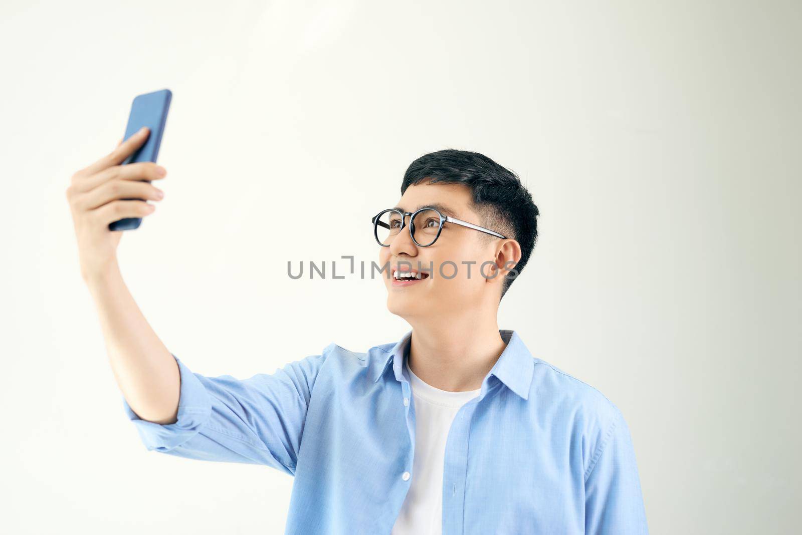 Manager taking pictures with his smartphone