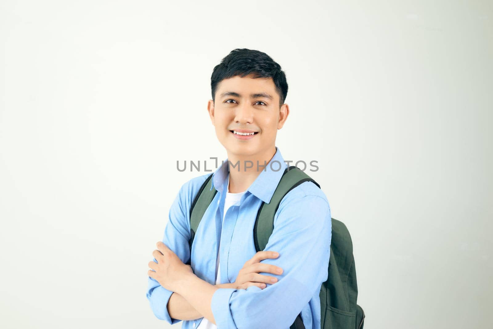 Handsome and friendly face man self-confident positive expression with crossed arms on white background  by makidotvn