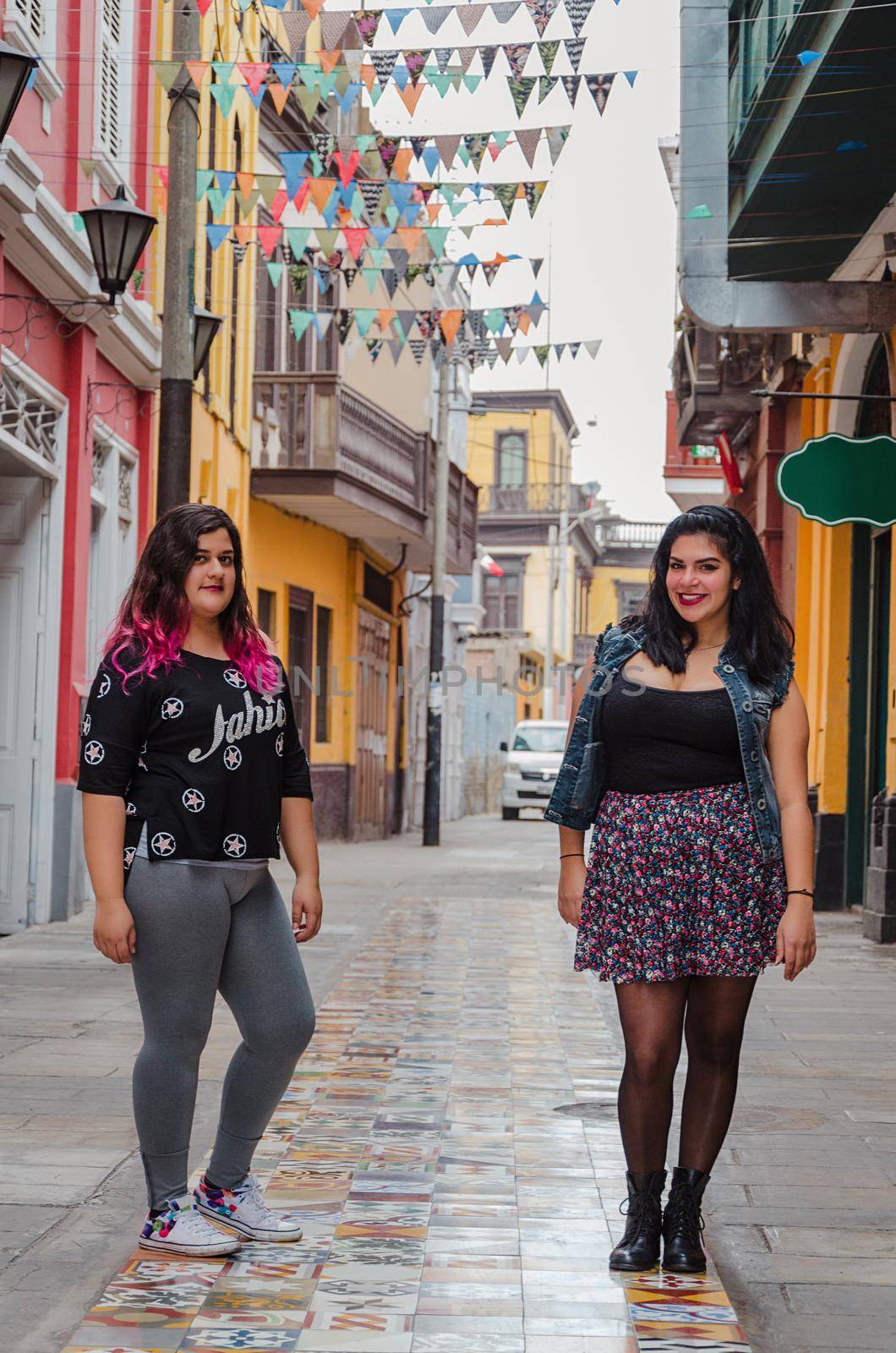 Portrait of beautiful chubby caucasian women in the street smiling to the camera