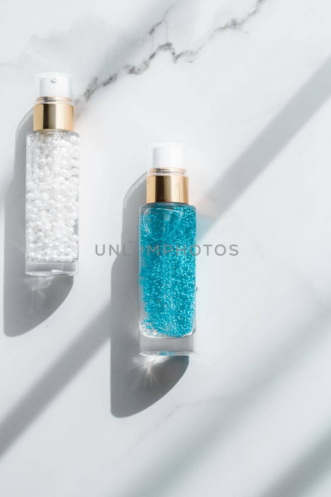 Cosmetic branding, packaging and make-up concept - Skin care serum and gel bottle, moisturizing lotion and lifting cream emulsion on marble, anti-age cosmetics for luxury beauty skincare brand design