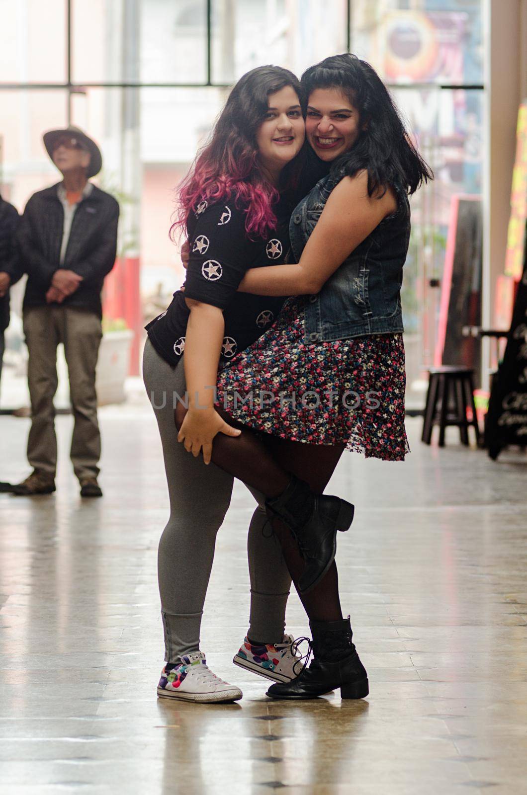 Portrait of beautiful chubby caucasian women in the street smiling to the camera