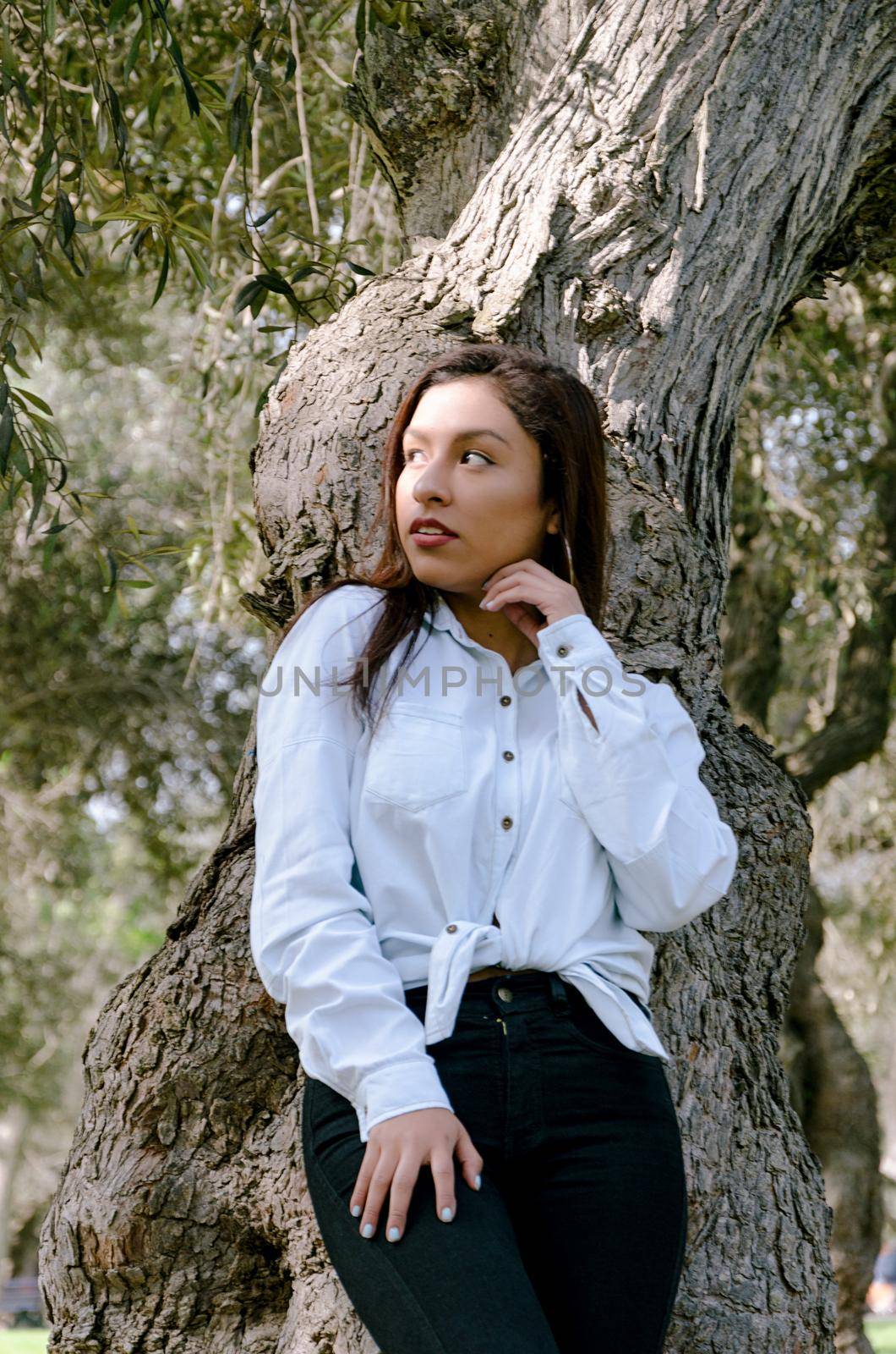 Fine art soft warm colors portrait of young tender innocent teenager girl with kind lovely face.