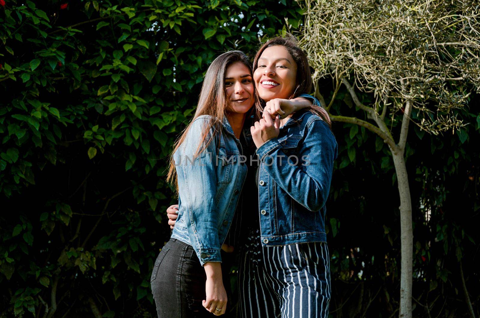 Outdoor lifestyle portrait of two best friends, smiling and having fun together