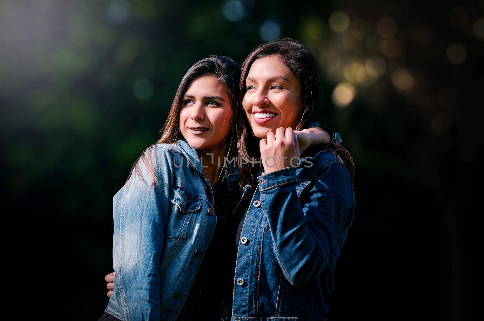 Outdoor lifestyle portrait of two best friends, smiling and having fun together