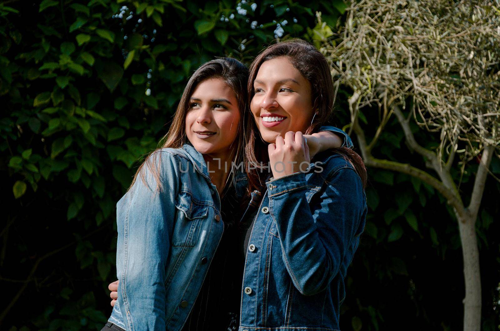 Outdoor lifestyle portrait of two best friends, smiling and having fun together