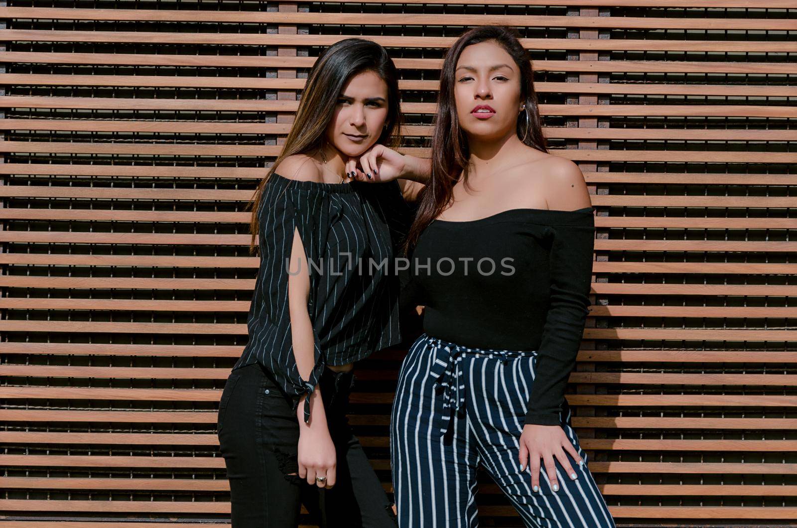 Outdoor lifestyle portrait of two best friends, smiling and having fun together