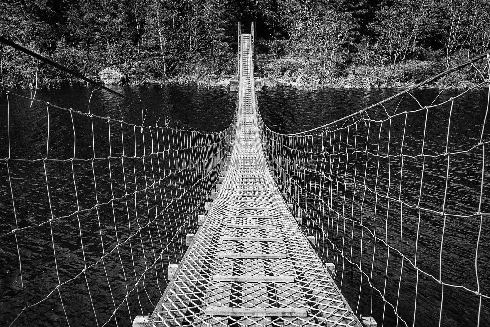 A suspension bridge crossing waters on a popular hiking area in south-west part of Norway.