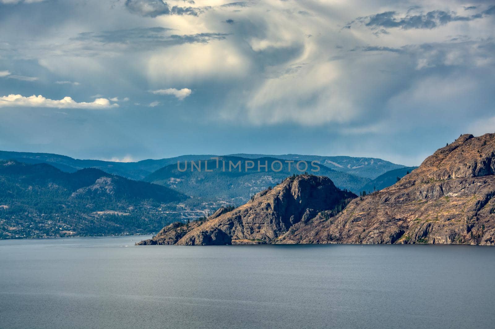 Scenery view of rocky mountain slope over the lake in British Columbia