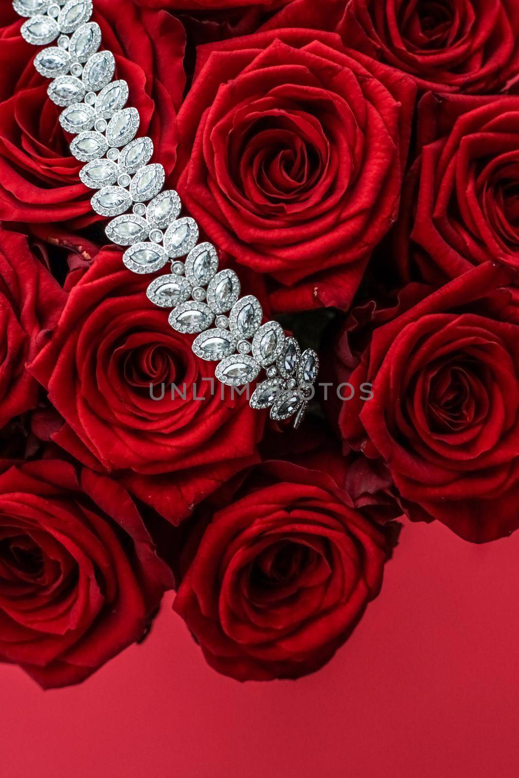 Gemstone jewellery, wedding fashion and luxe shopping concept - Luxury diamond bracelet and bouquet of red roses, jewelry love gift on Valentines Day and romantic holidays present