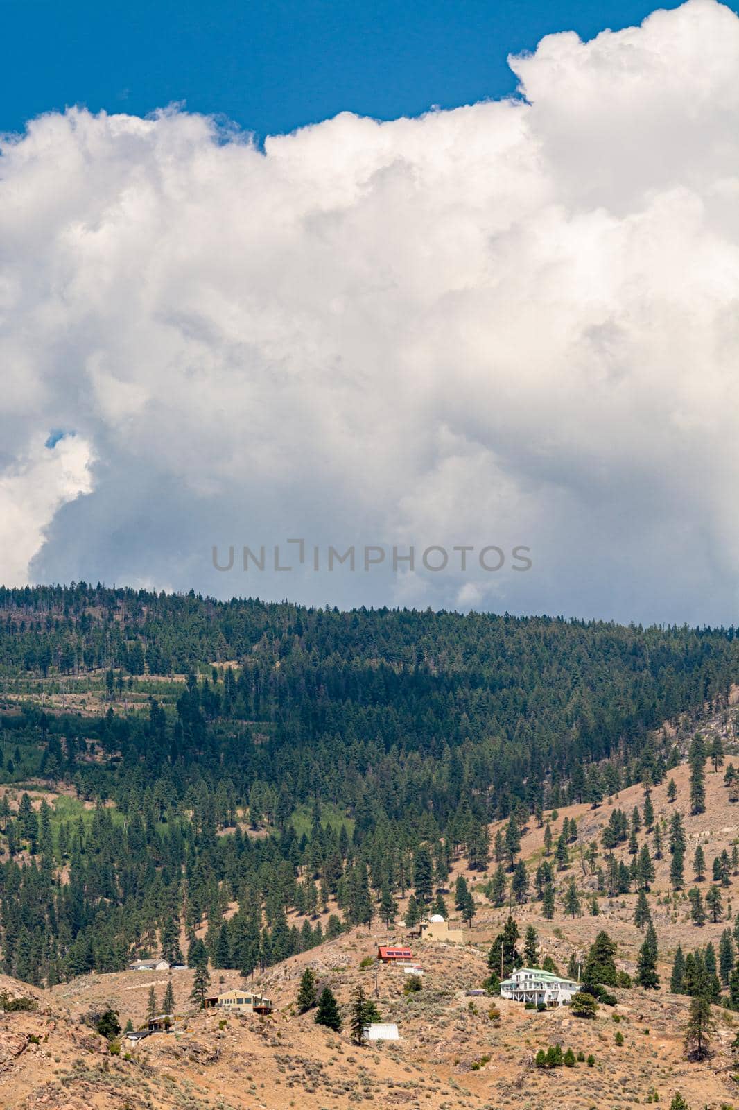 Summer mountains landscape on cloudy sky background in Okanagan valley