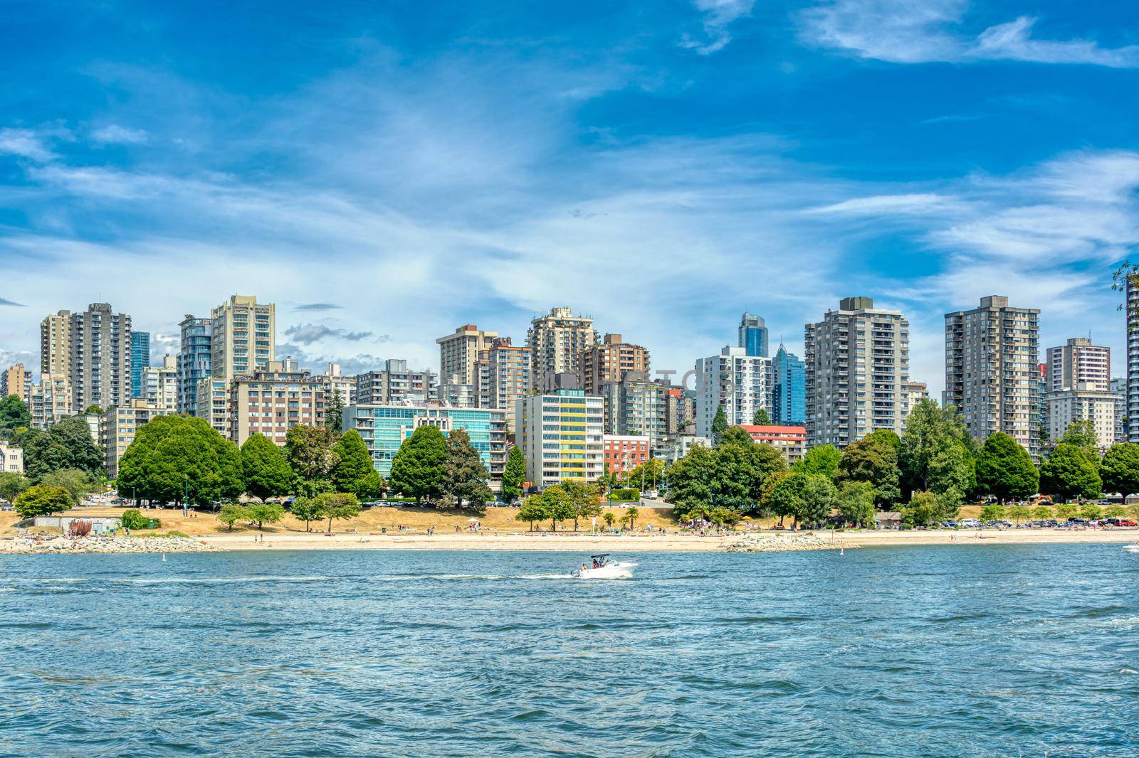 View on old part of Vancouver downtown over Coal harbor. Downtown view with cloudy sky background