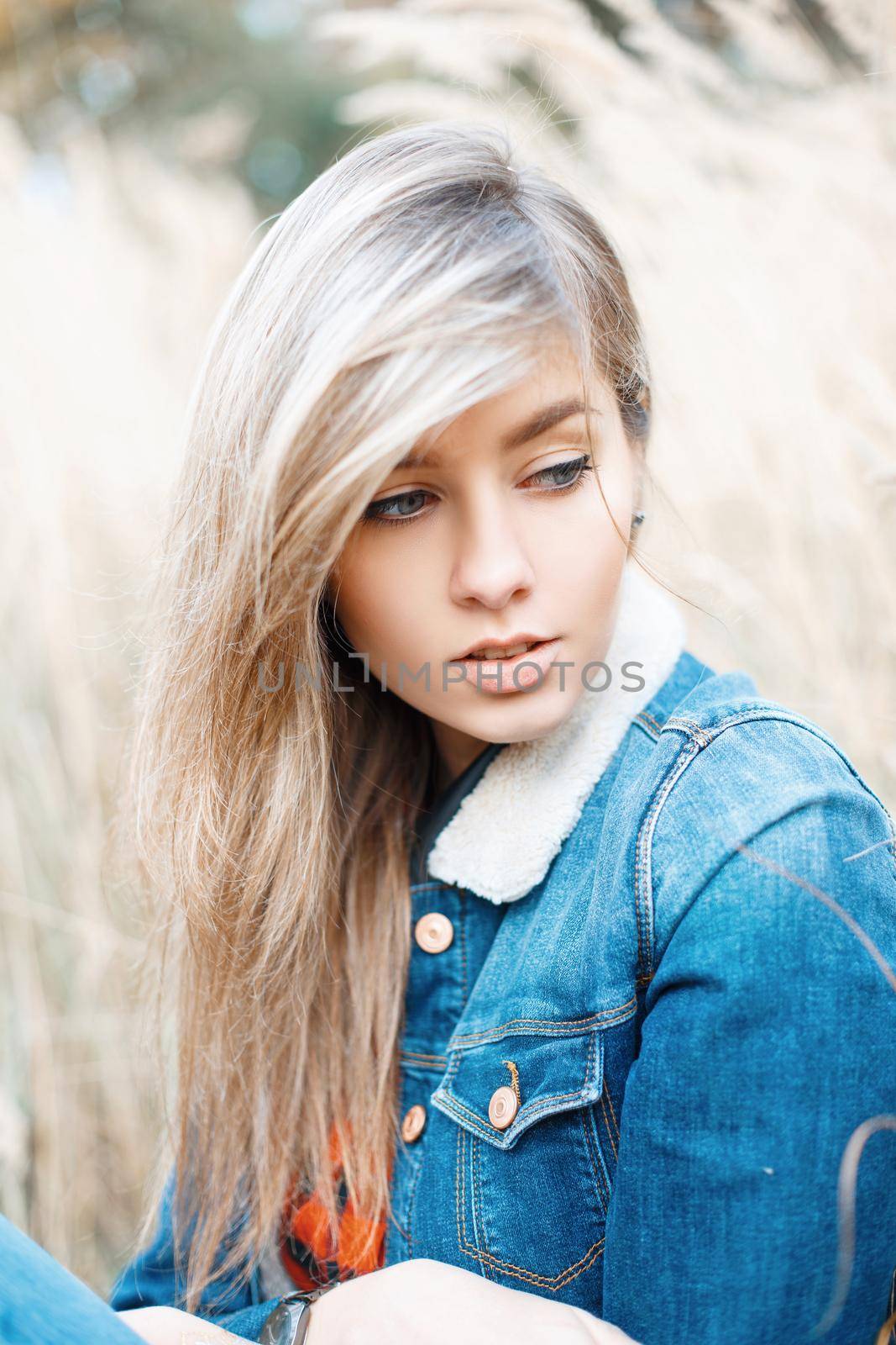 Close-up portrait of a beautiful ????? in a denim jacket