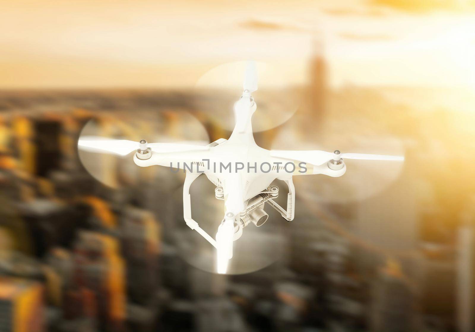 Quadrocopter drone with the camera on the background of the city by alones
