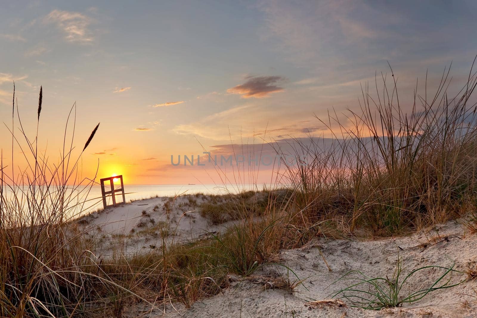 Sunset and dune grass in the foreground by Lincikas