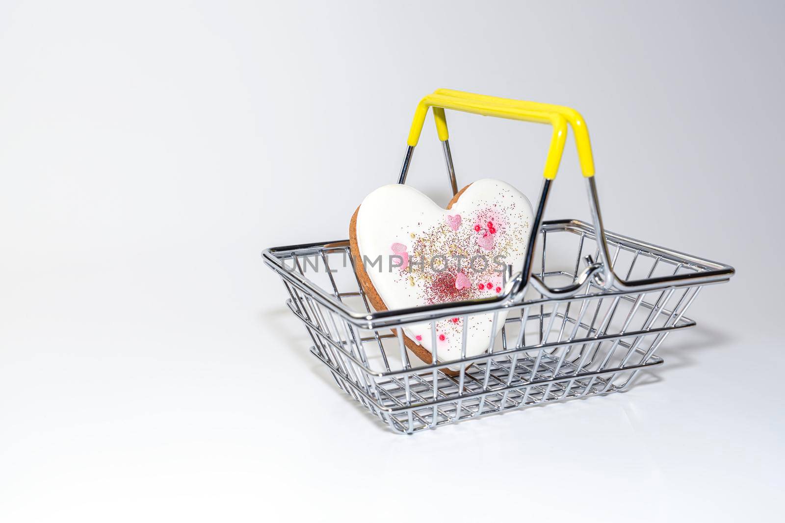 ginger cookies in the form of a heart in a supermarket basket. High quality photo