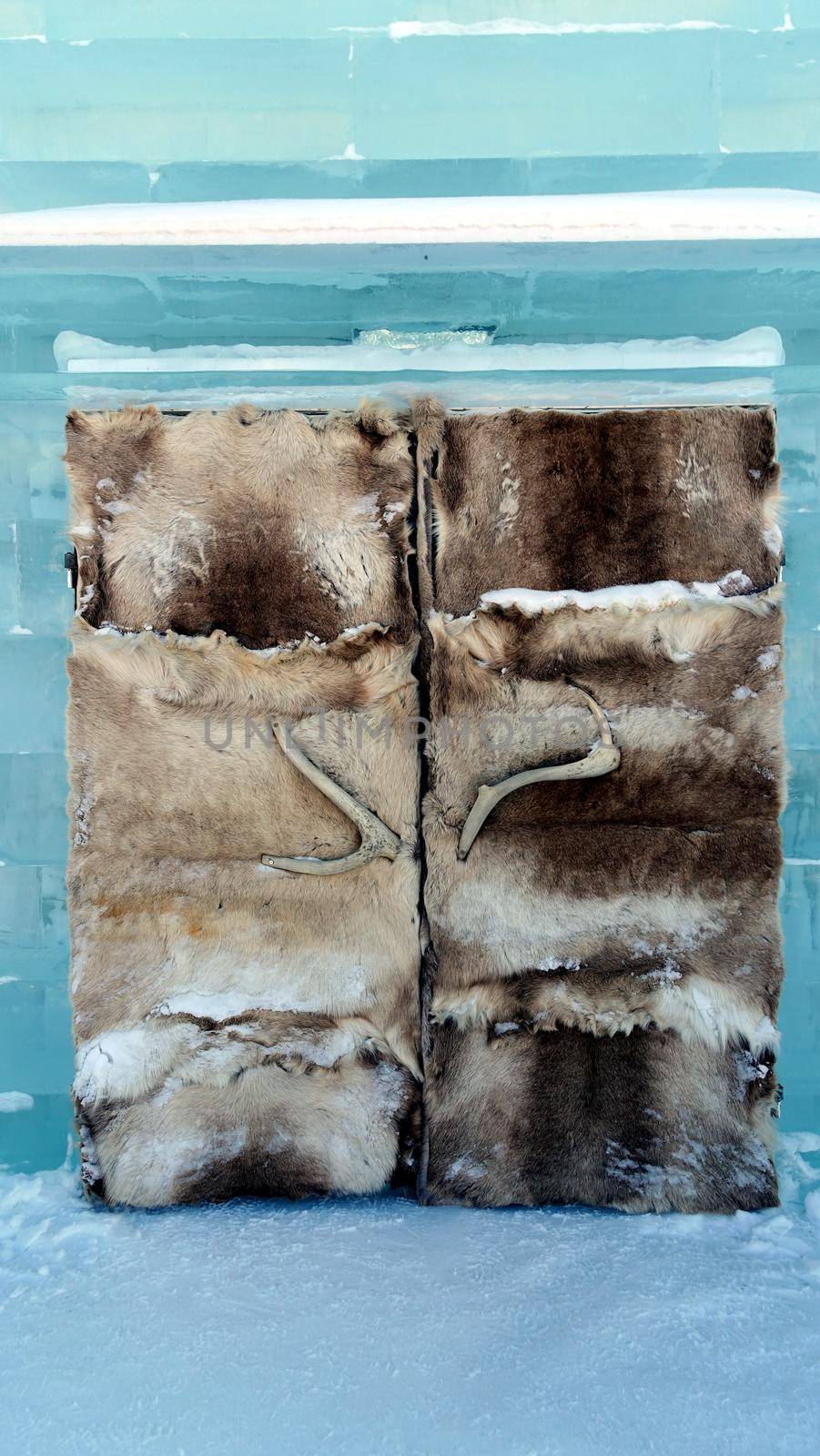 Jukkasjarvi, Sweden, February 27, 2020. one of the doors of the ice hotel covered with leather and reindeer horns