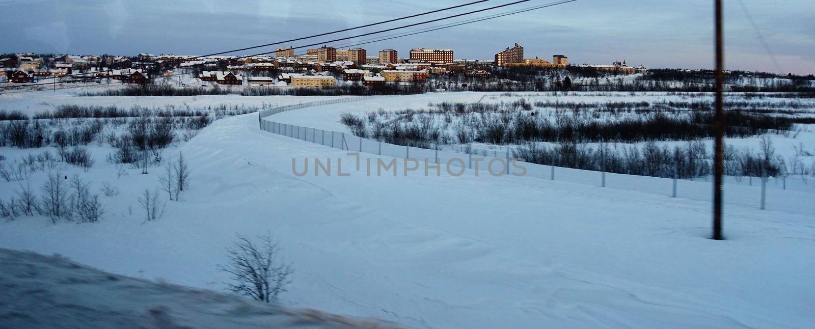 landscape of Kiruna in Sweden during a winter evening