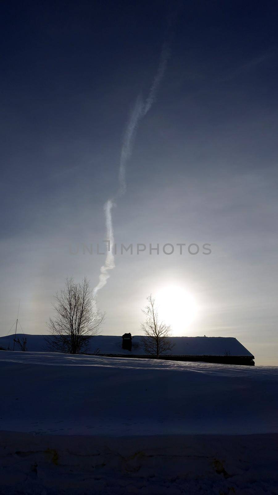 snowy winter landscape of Kiruna in northern Sweden during sunset