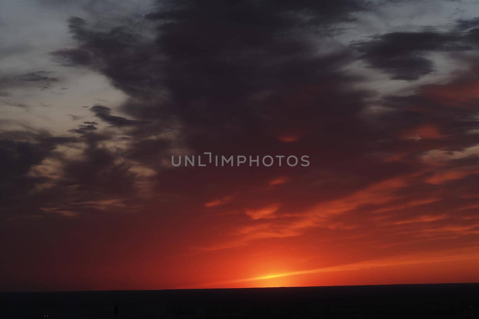 It's a beautiful sunset. horizon. The sky in the evening with clouds and the setting sun. High quality photo