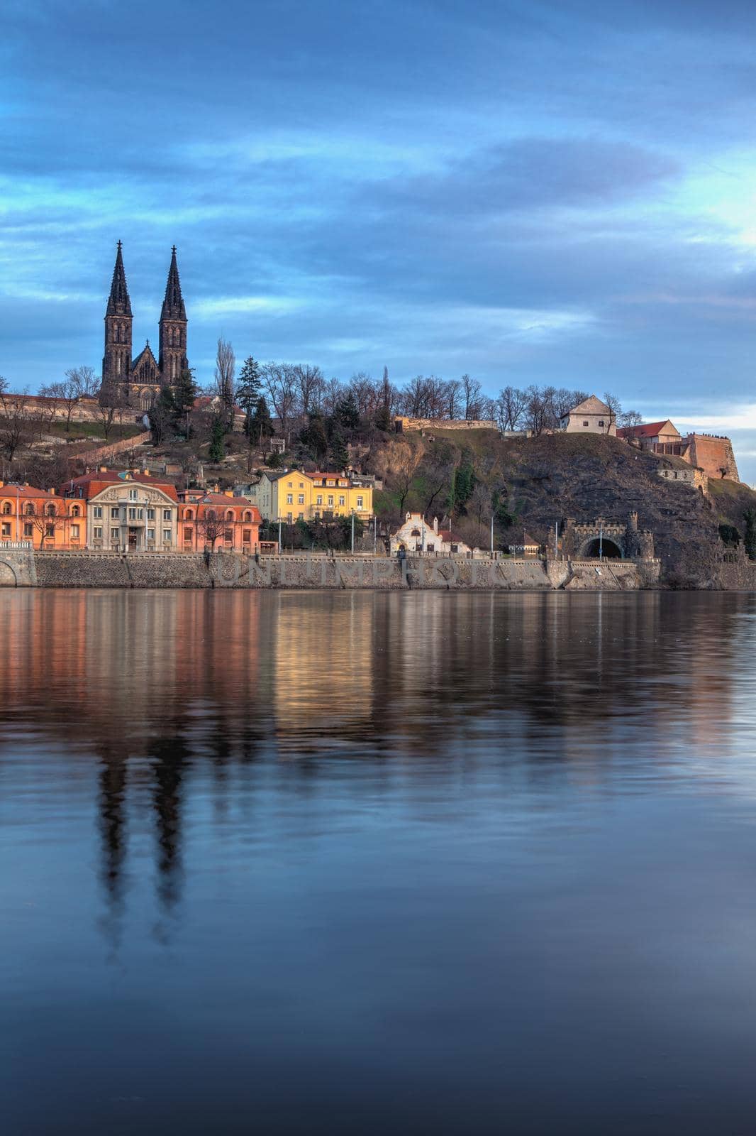 View on the Vysehrad fort in the dramatic evening, Prague, Czech Republic. Vyšehrad is a historic fort located in the city of Prague. It was built probably in the 10th century.