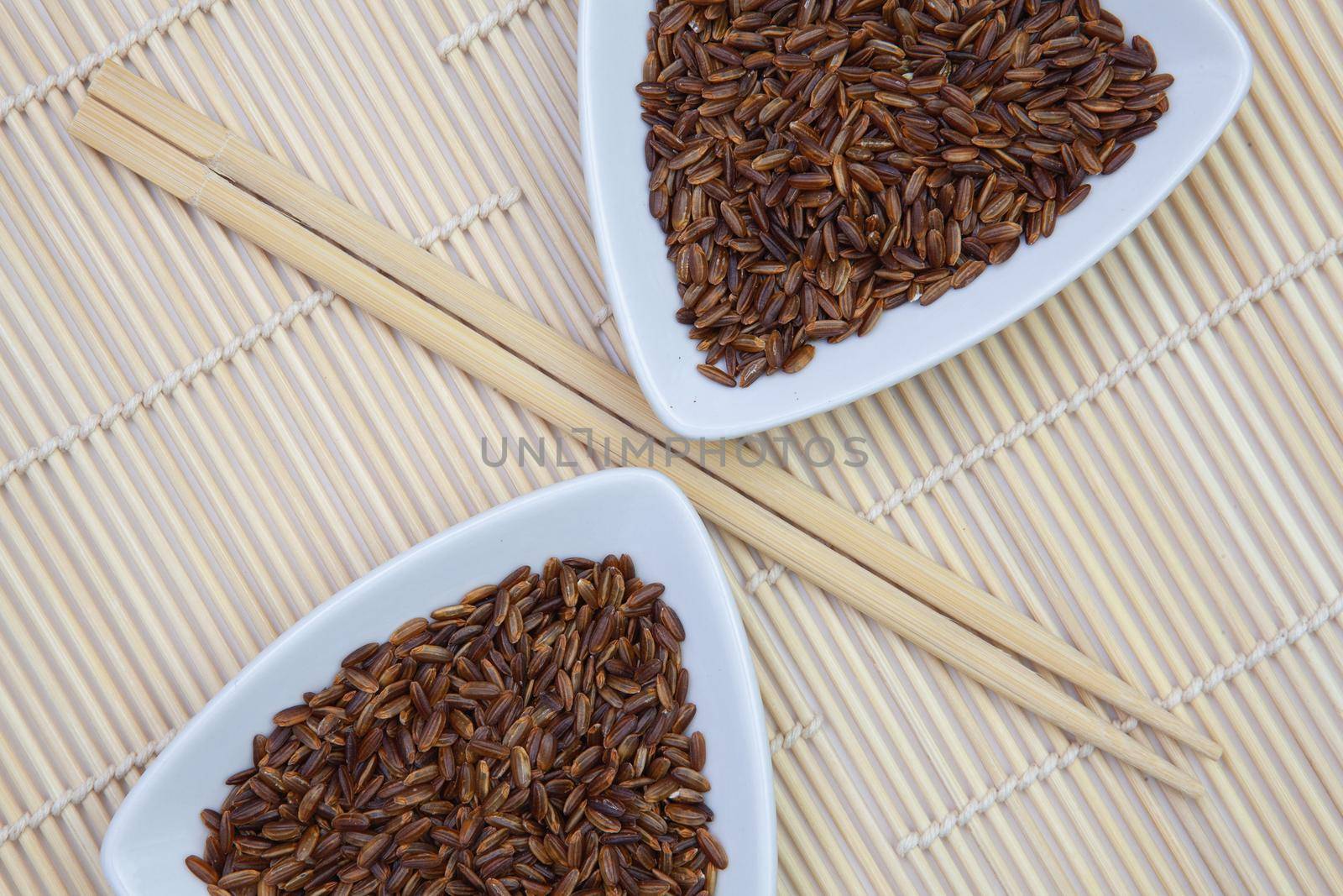 Top View Of White Sushi Plate With Rise And Chopsticks. Symmetry Food Design