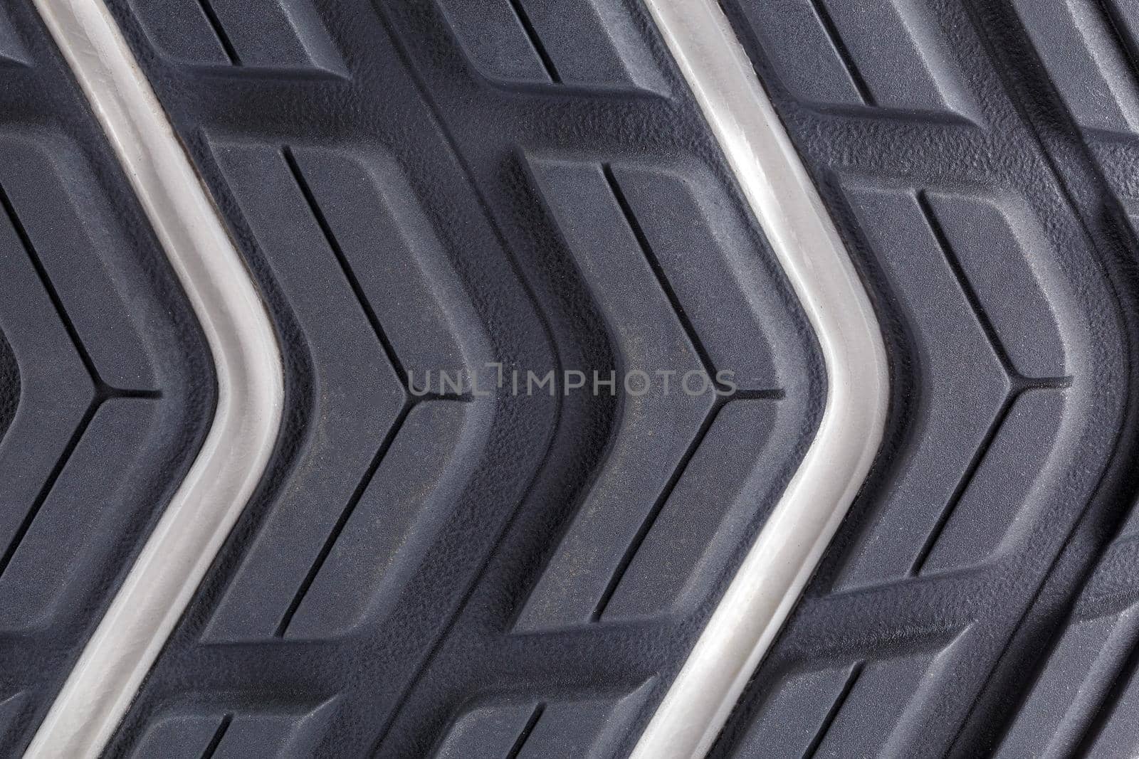 close-up full frame background of new generic contemporary sneakers outsole with protector shapes.