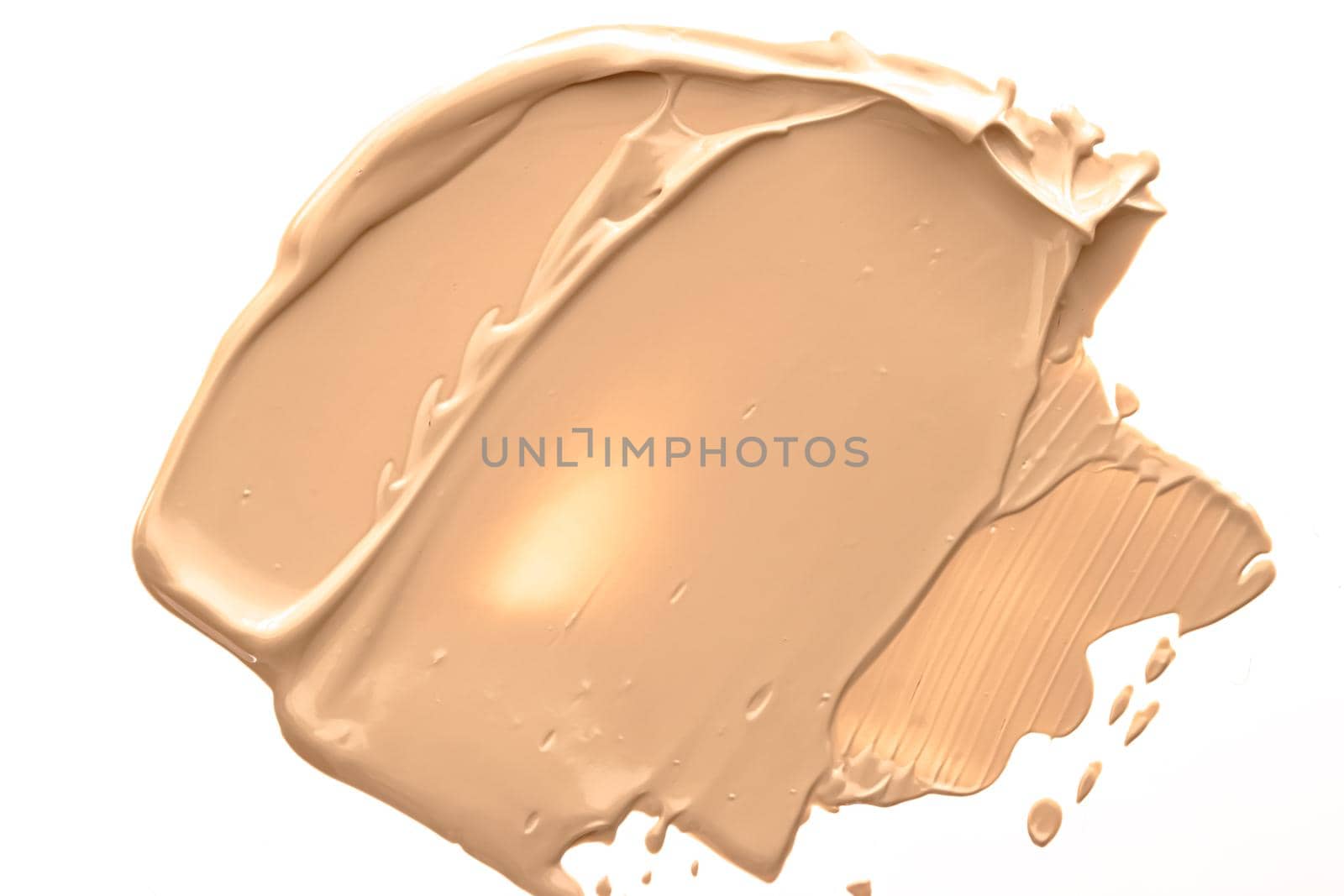 Beige beauty cosmetic texture isolated on white background, smudged makeup emulsion cream smear or foundation smudge, crushed cosmetics product and paint strokes.