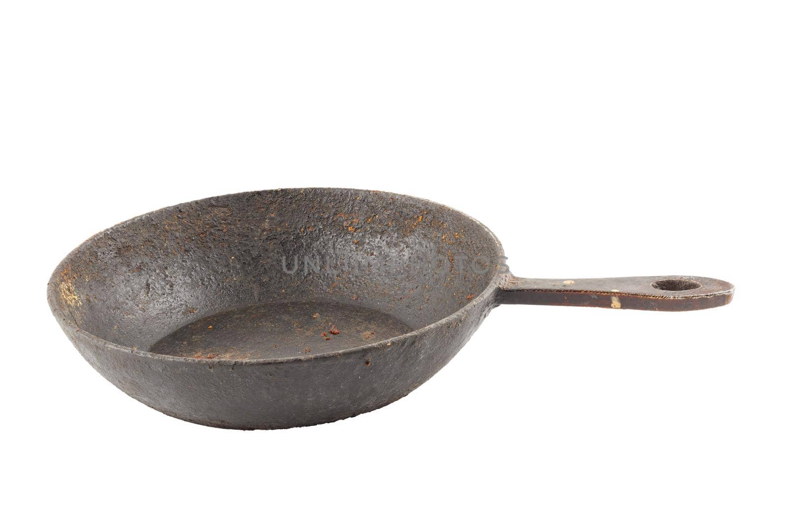 old disgusting stained rusty cast iron pan with burnt fat and food leftovers isolated on white background