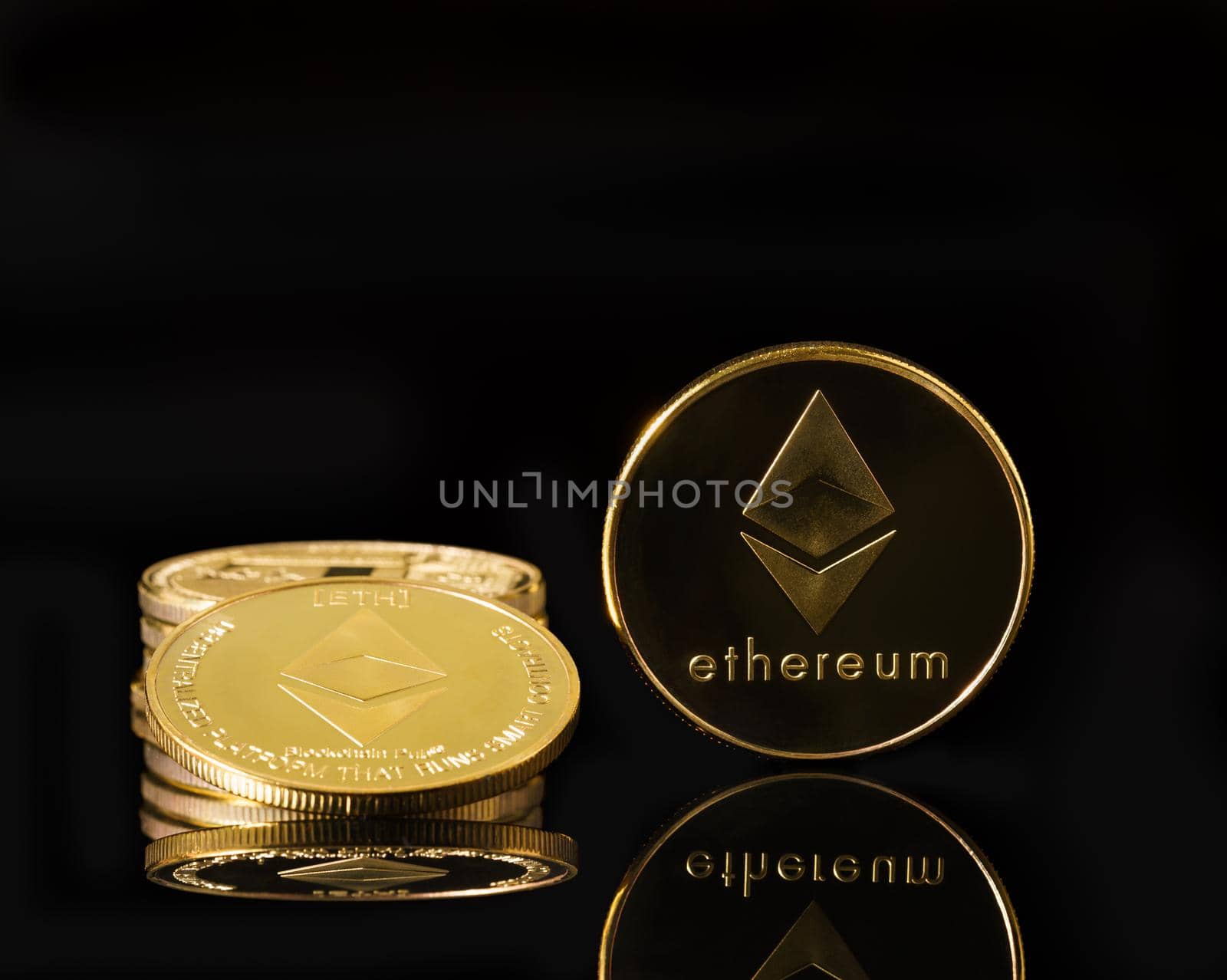 Ethereum cryptocurrency digital bit coin ETH currency concept ,Golden coins with Ethereum symbol on a black background